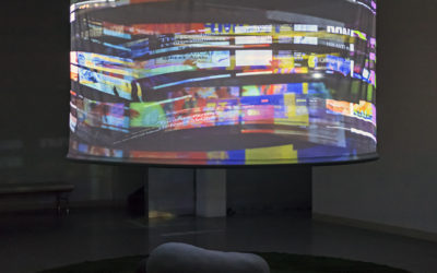 6393a003c67aefe1-DysUnion_Cover16bit100dpi State of the DysUnion
3-channel HD video projection onto custom screen, astroturf, soft sculpture; 8:30 minutes looped, 12' diameter astroturf, 8' diameter screen, 2018